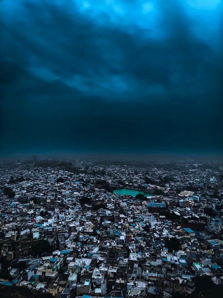 An aerial view of a city under a cloudy sky