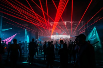 A group of people standing in front of a stage