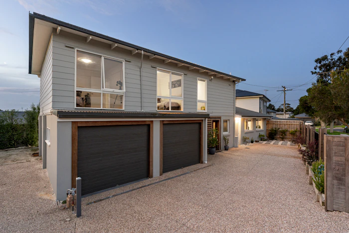 Double storey contemporary home with a rendered facade.