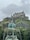 A fountain with a castle in the background