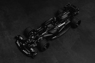 A black and white photo of a racing car