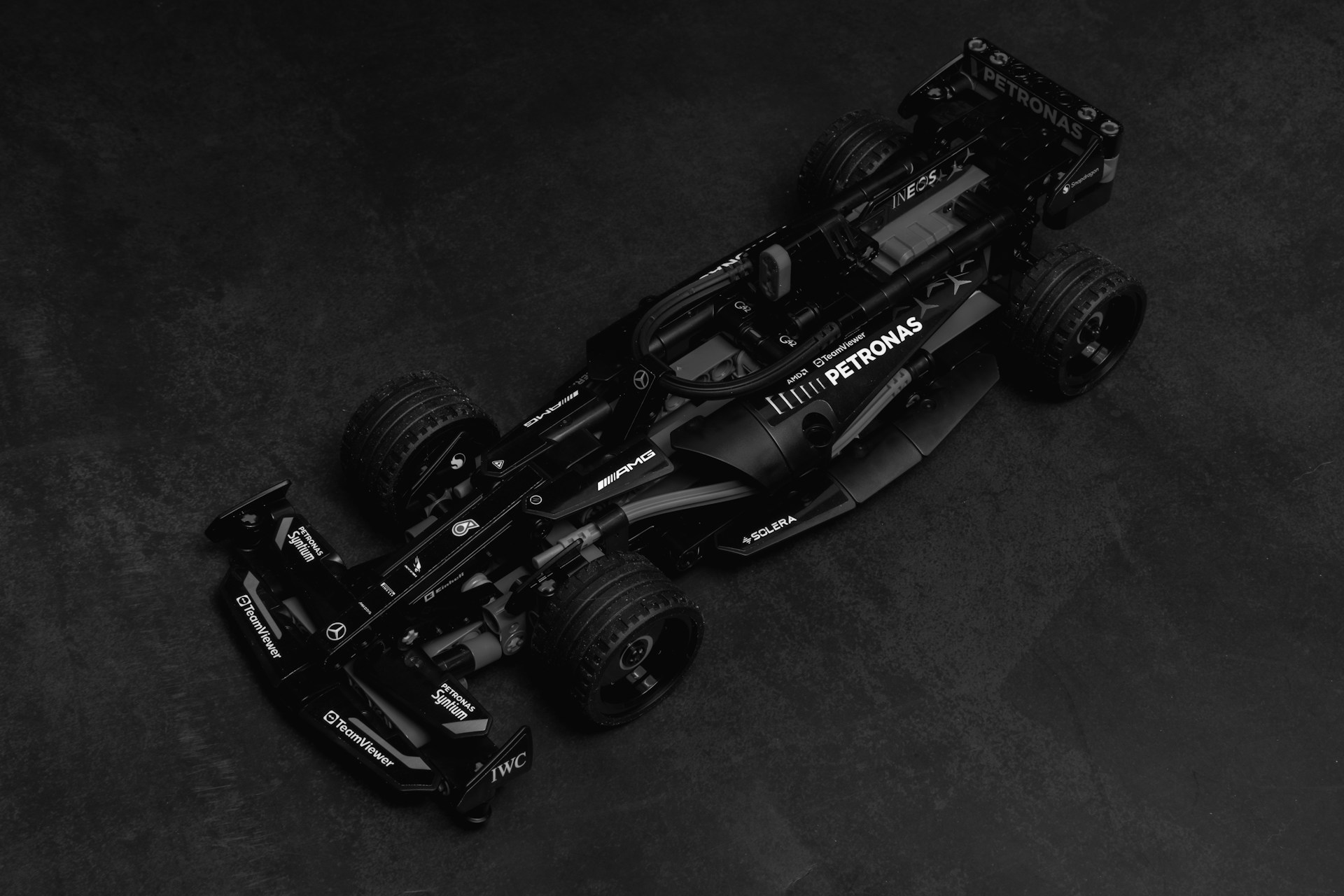 A black and white photo of a racing car