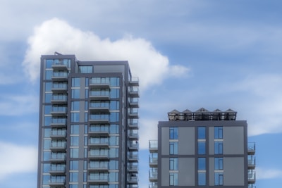 A couple of tall buildings sitting next to each other