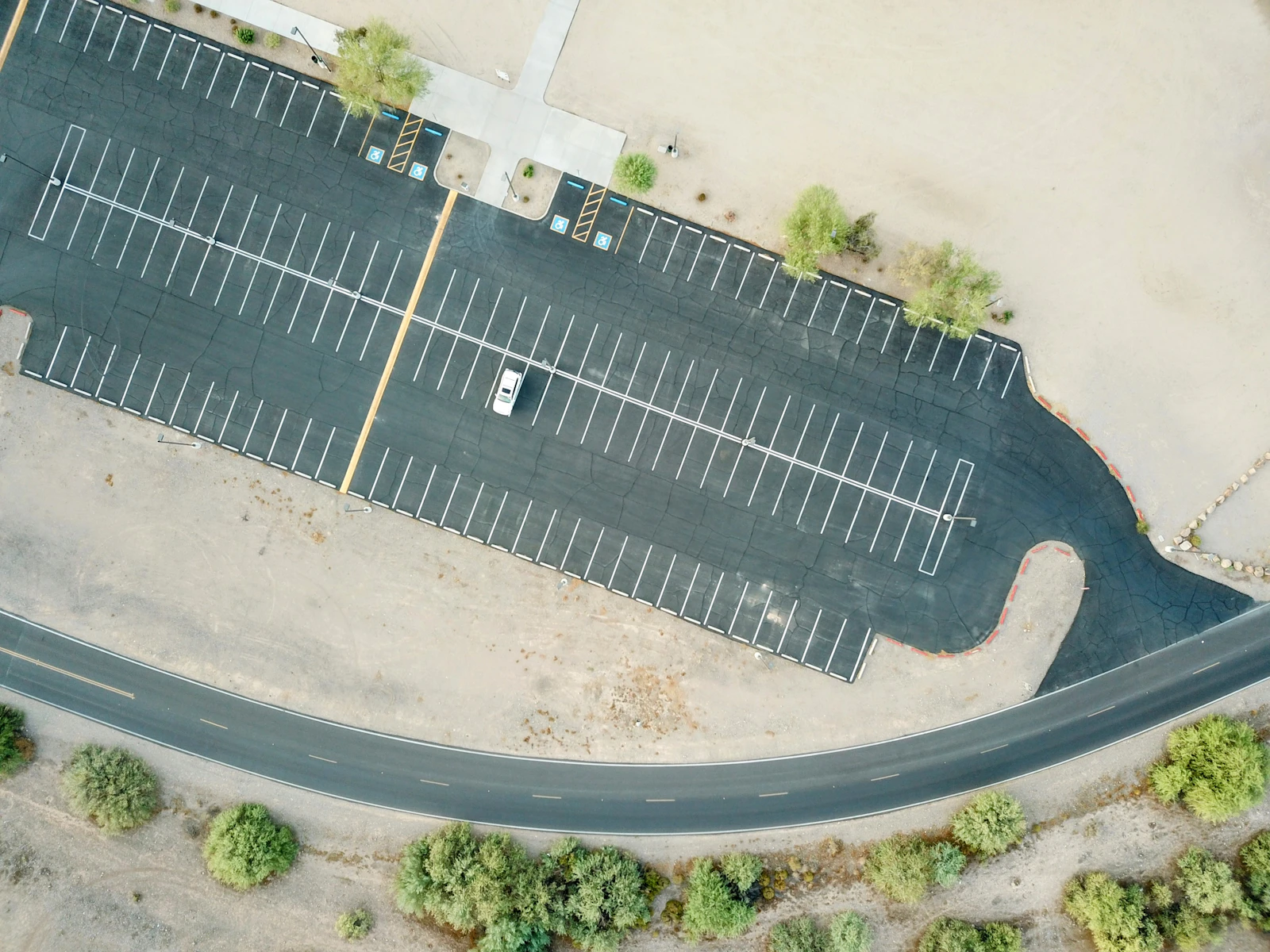 Freshly paved and striped parking lot from above