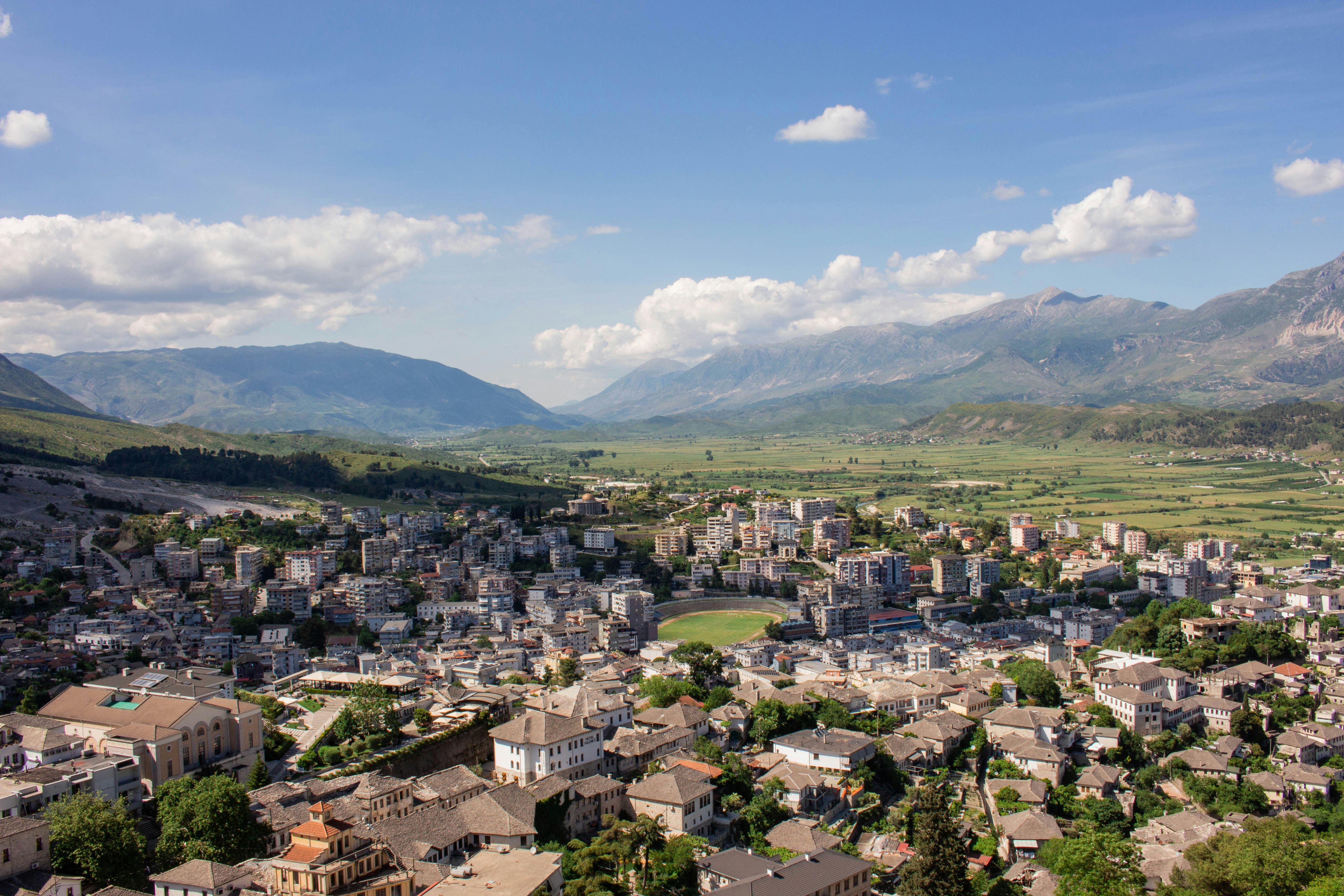A view of a city with mountains in the background