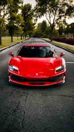 A red sports car parked on the side of a road
