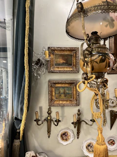 A room with a lamp and pictures on the wall