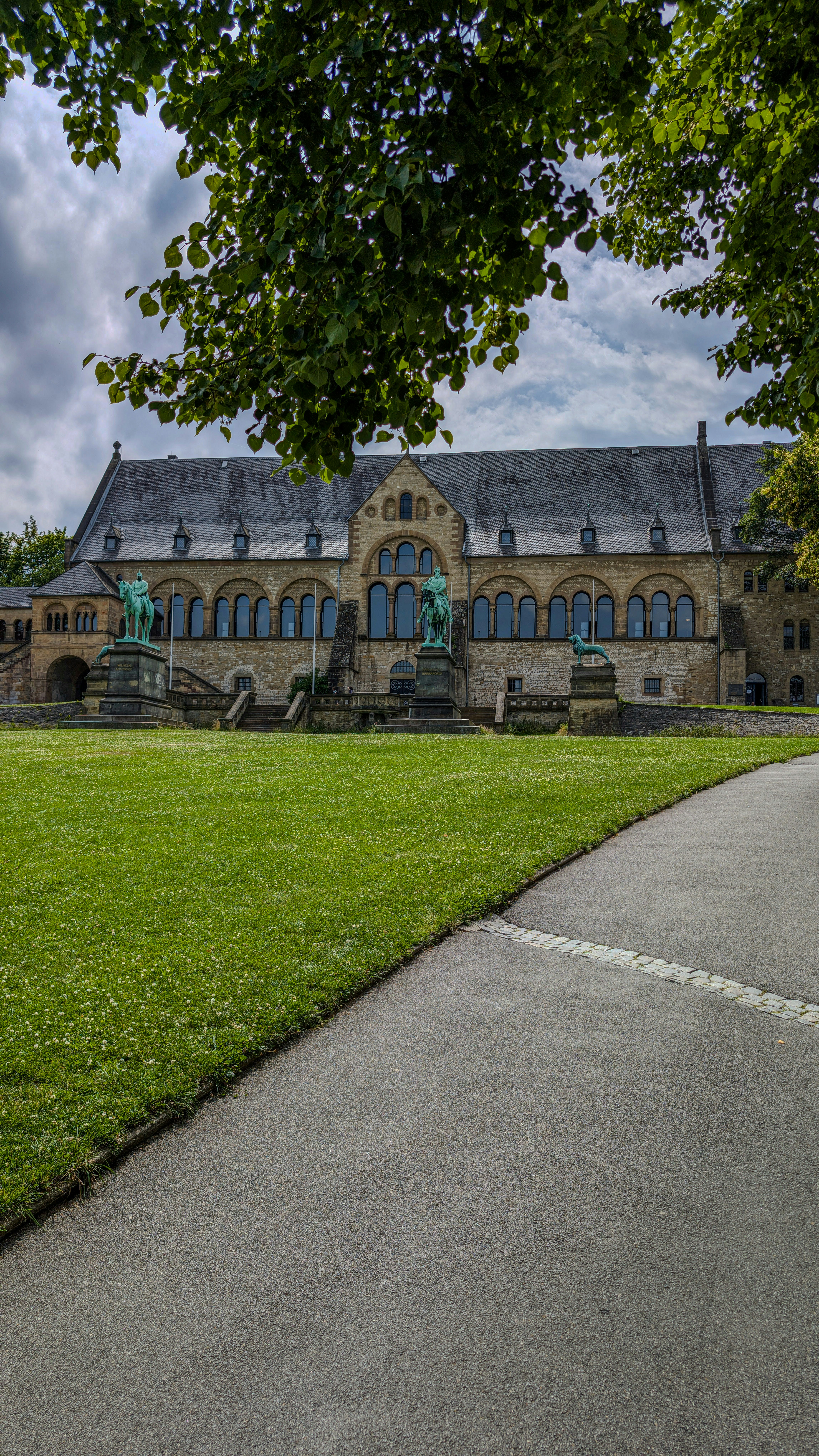 A large building sitting on top of a lush green field