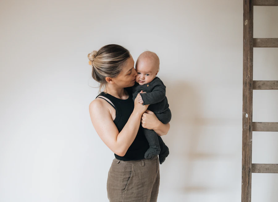 A parent holding a young child outdoors