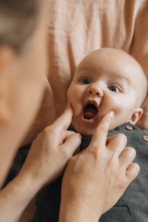 A woman holding a baby in her arms