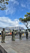 A statue of a group of men standing next to each other