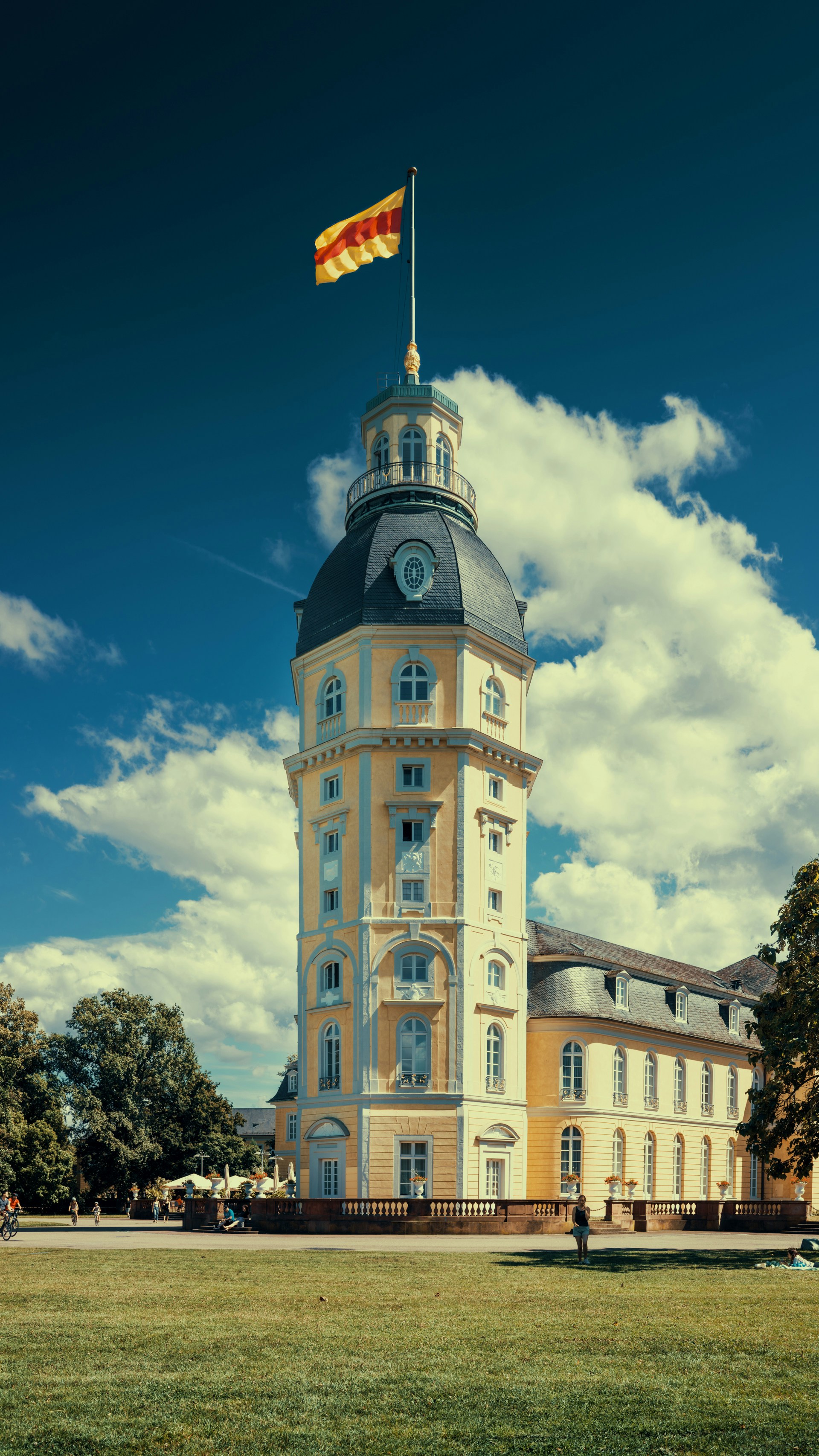 A tall building with a flag on top of it