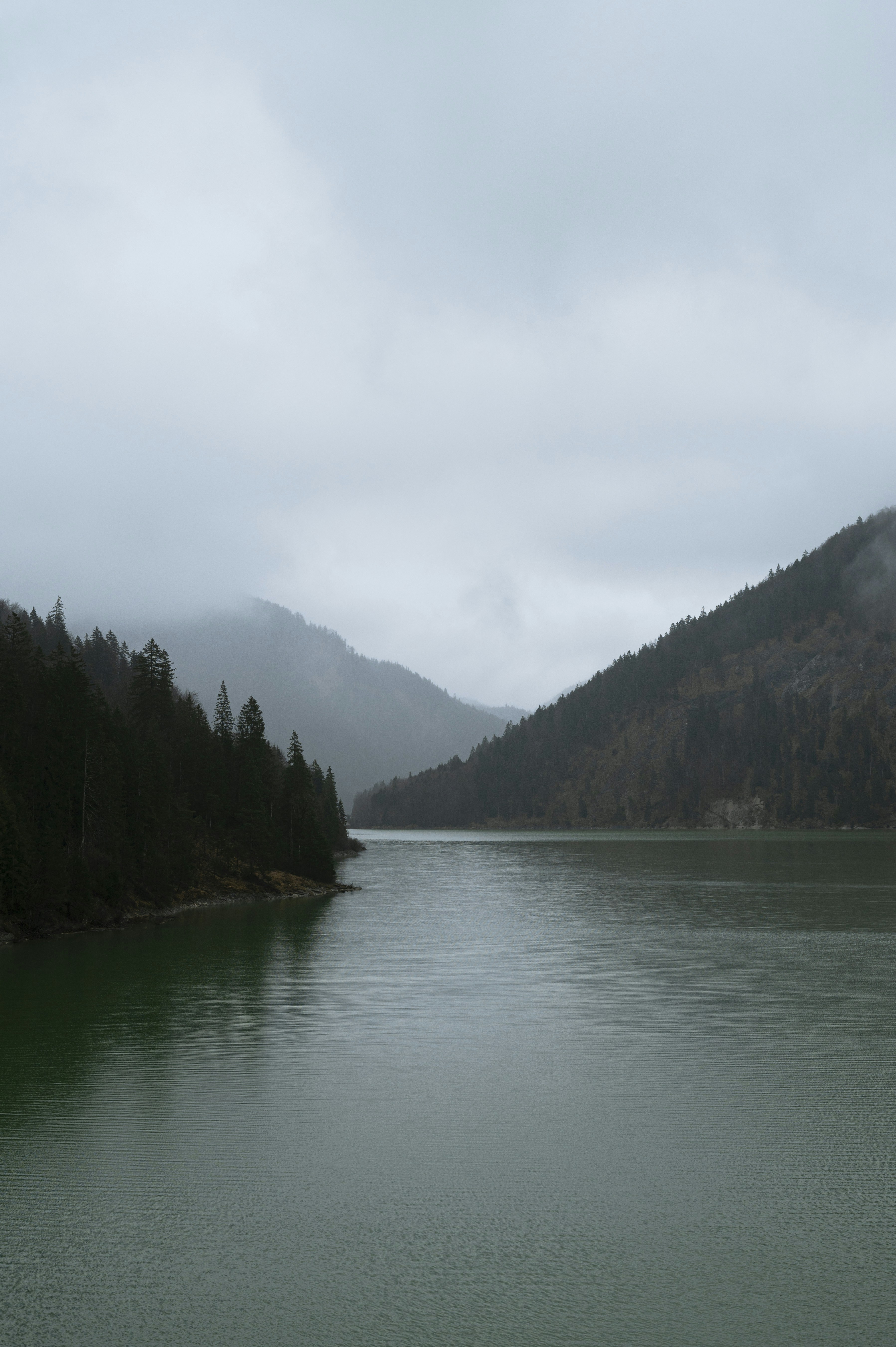 A large body of water surrounded by mountains
