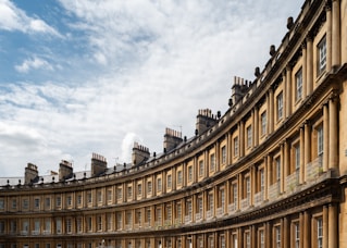 A curved building with a blue sky in the background