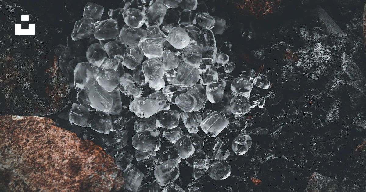 Ice In Rocks A bunch of ice crystals sitting on top of a rock photo – Free Ice Image ...