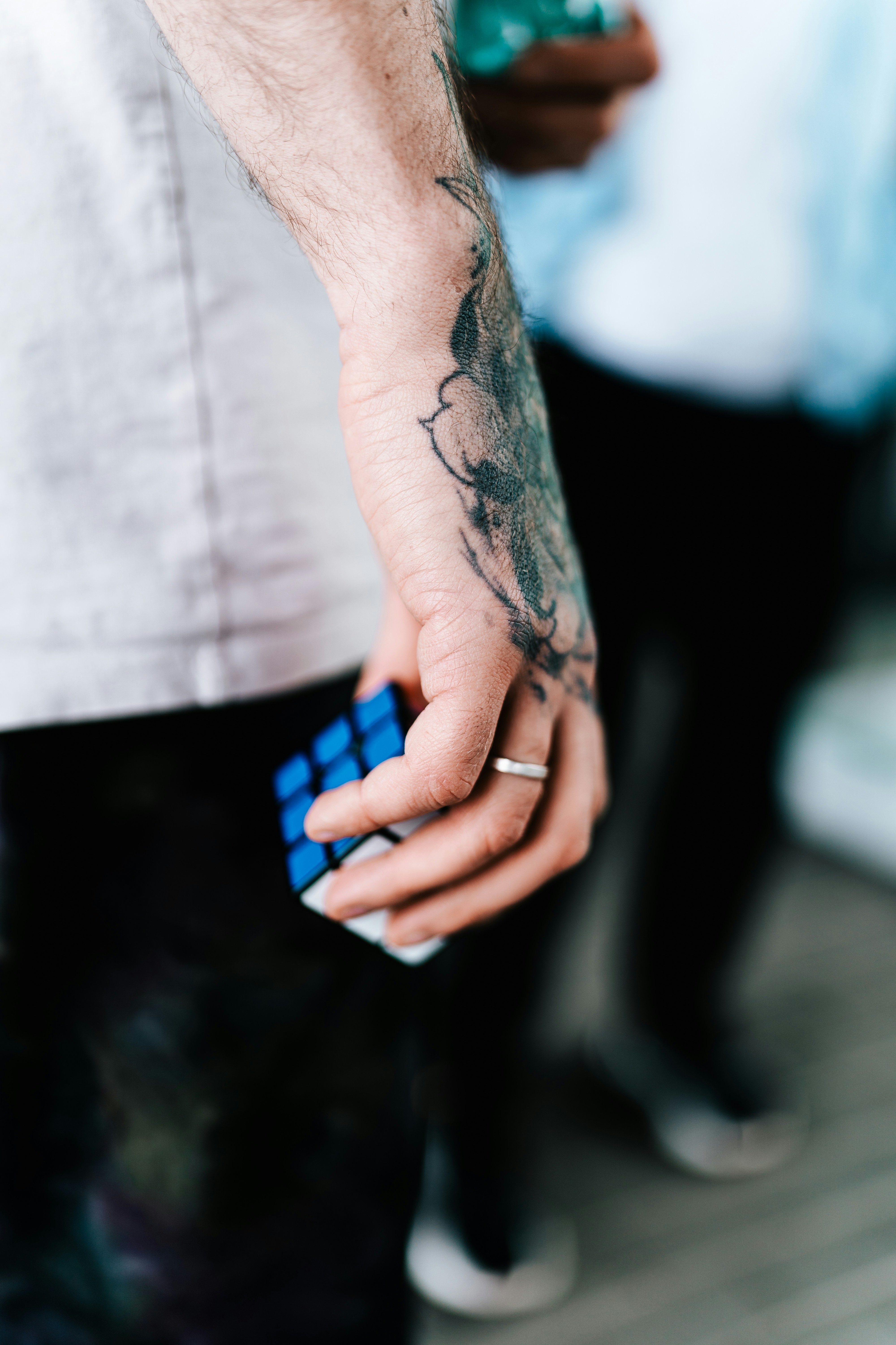 A man holding a rubik cube in his hand