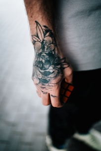 A man with a tattoo on his hand