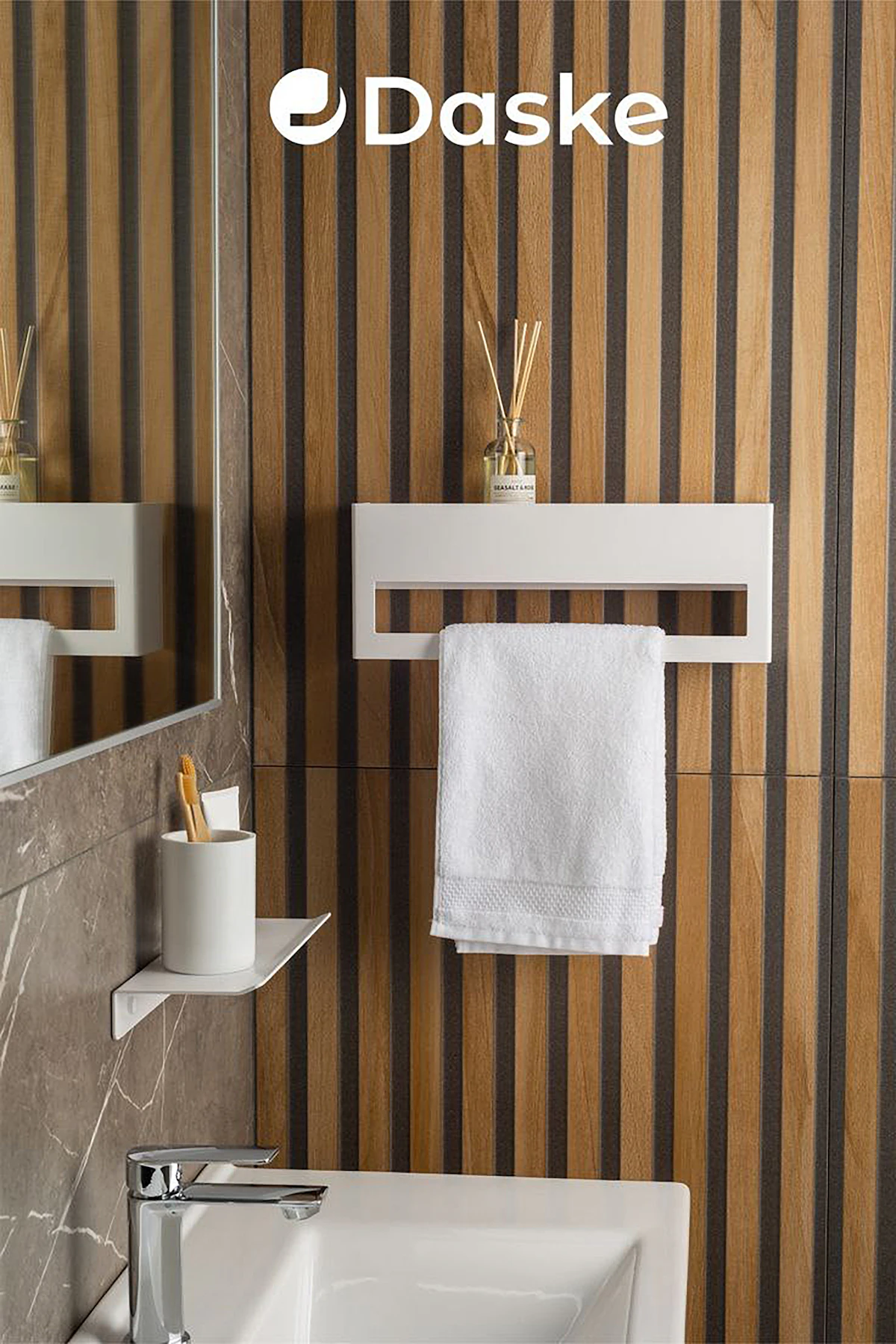 Adhesive hooks holding towels in a small rented bathroom