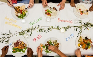 A group of people sitting around a table eating food