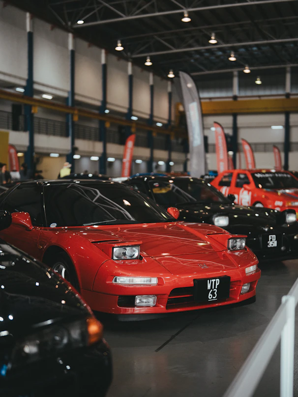 A group of cars parked in a garage