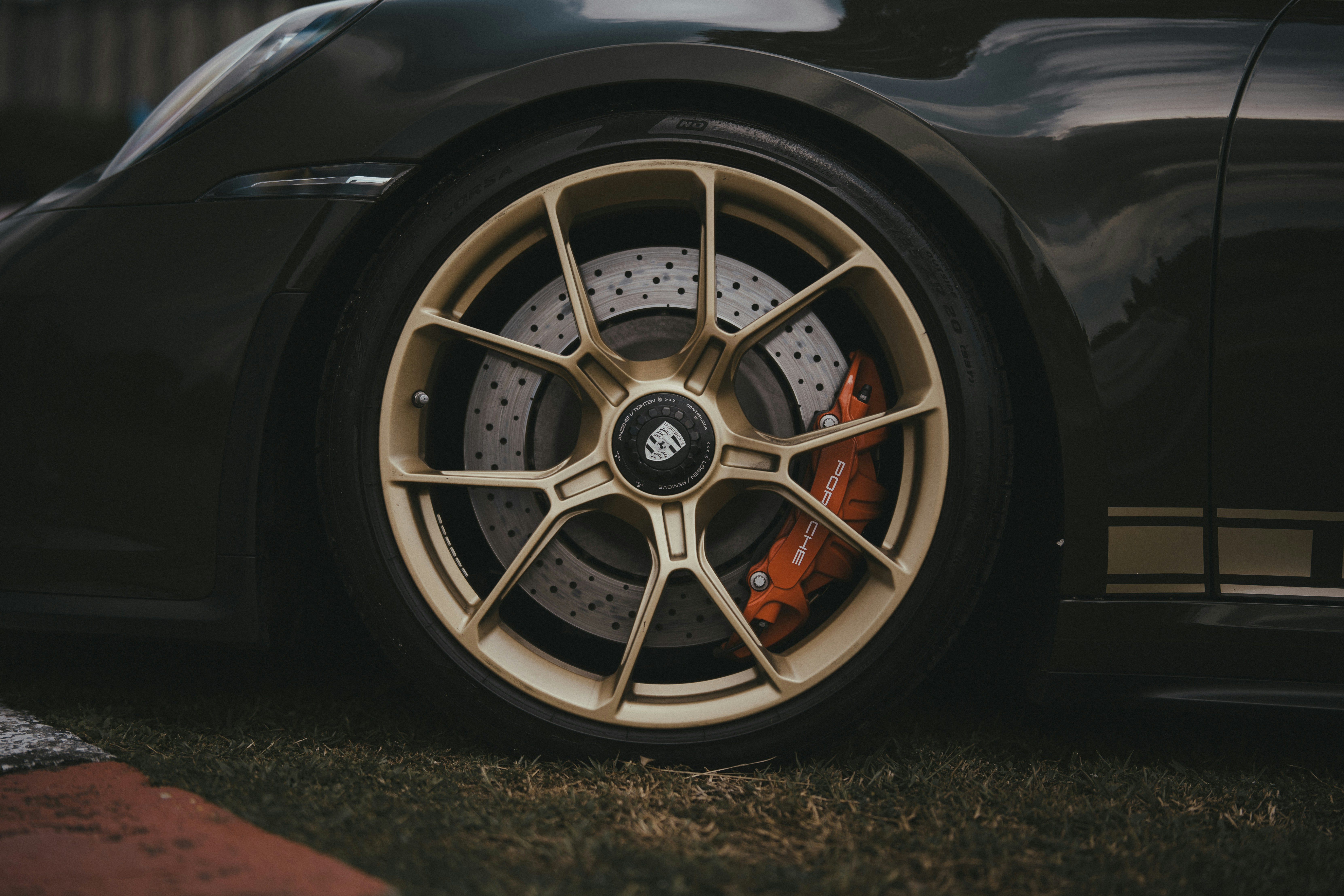A black sports car parked on the side of the road