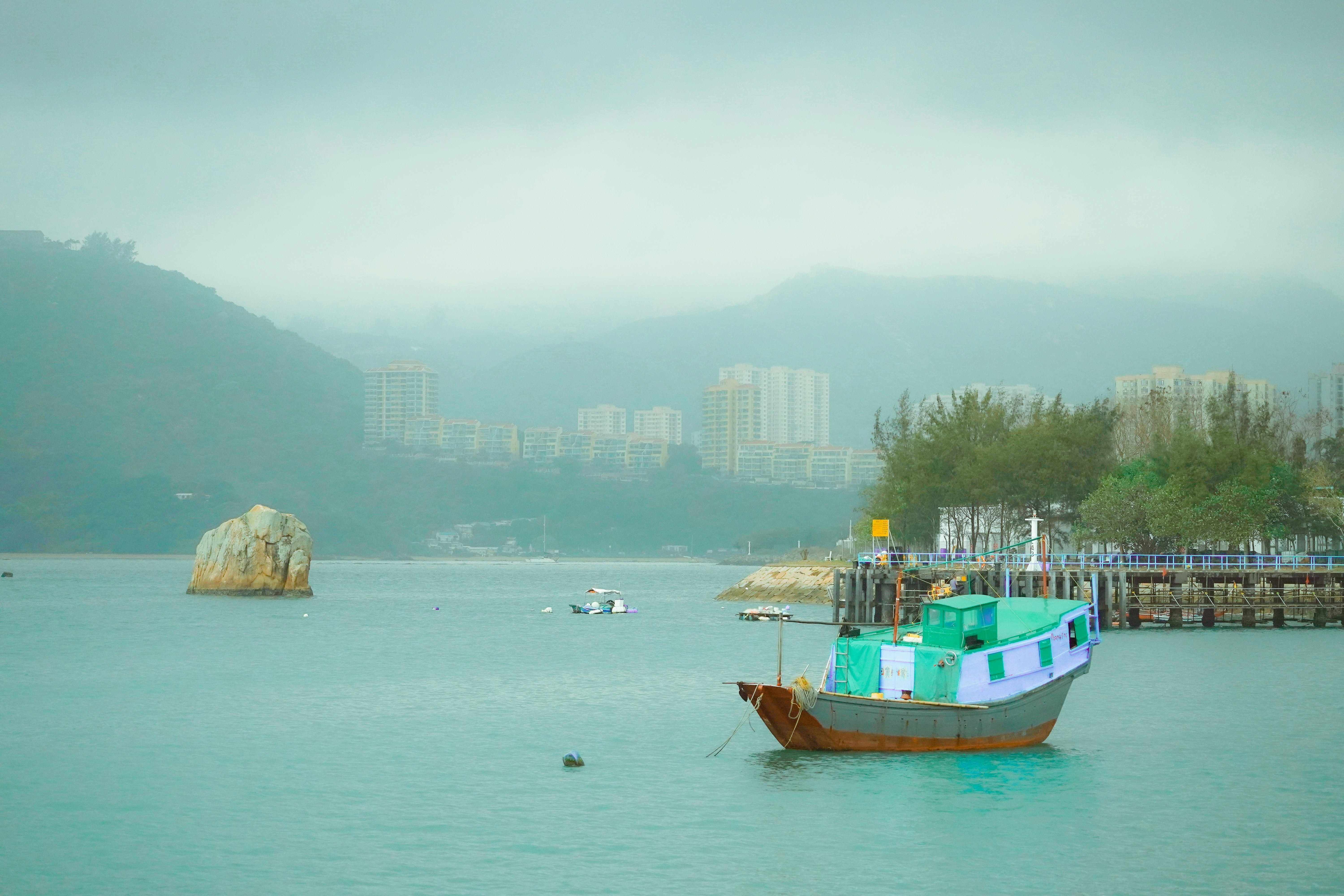 A boat floating on top of a large body of water