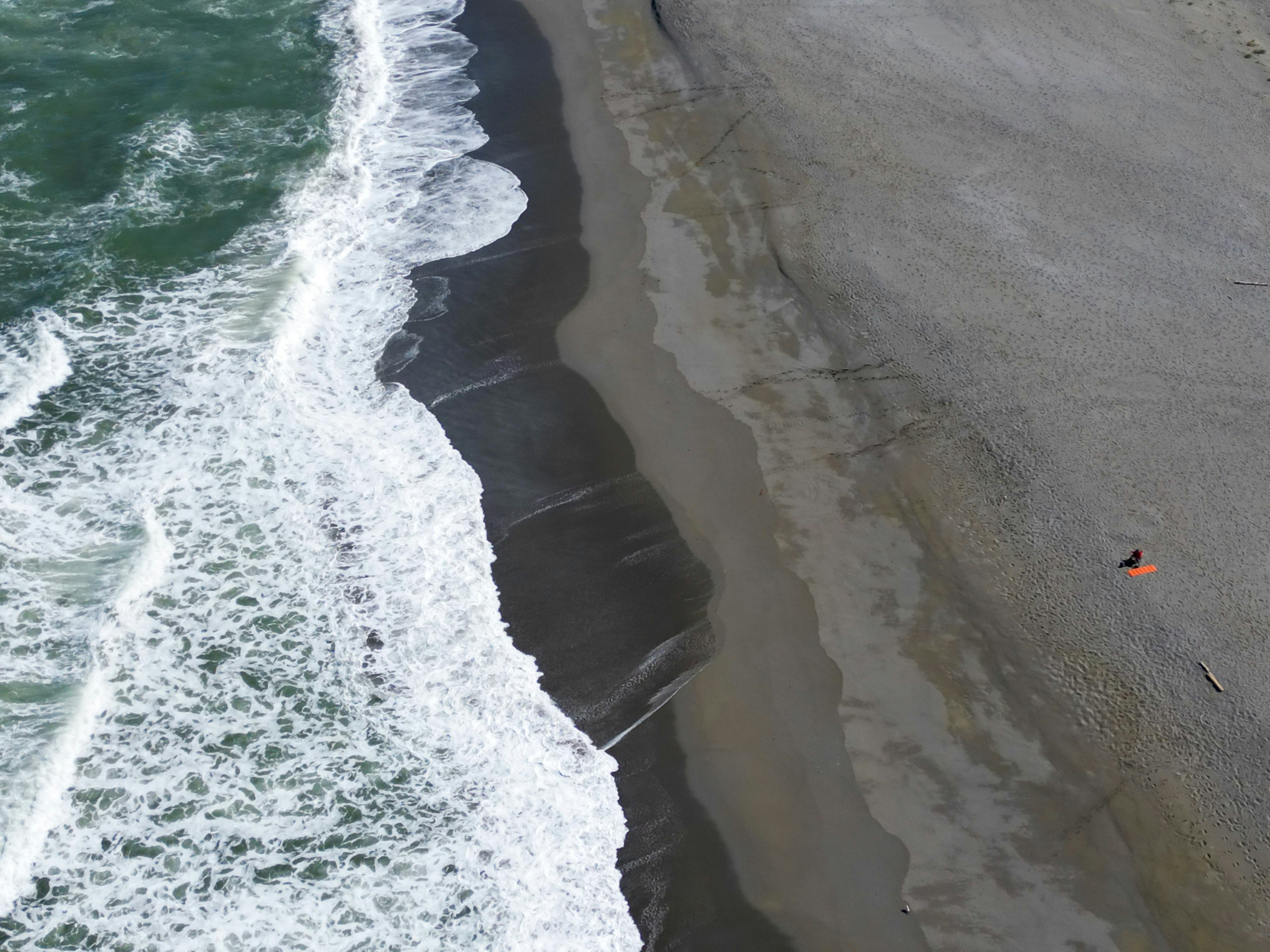 An aerial view of a beach and ocean