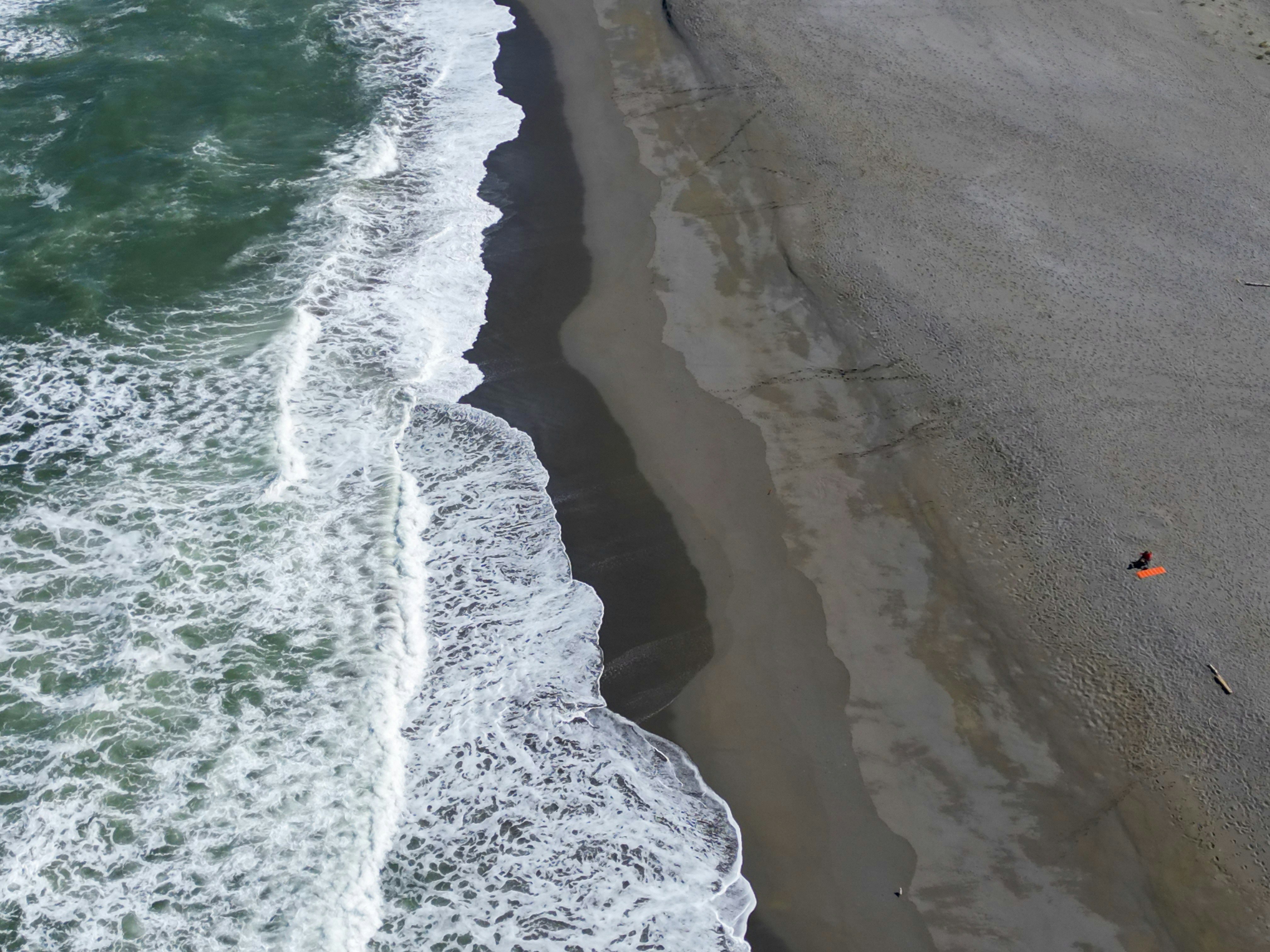 An aerial view of a beach and ocean