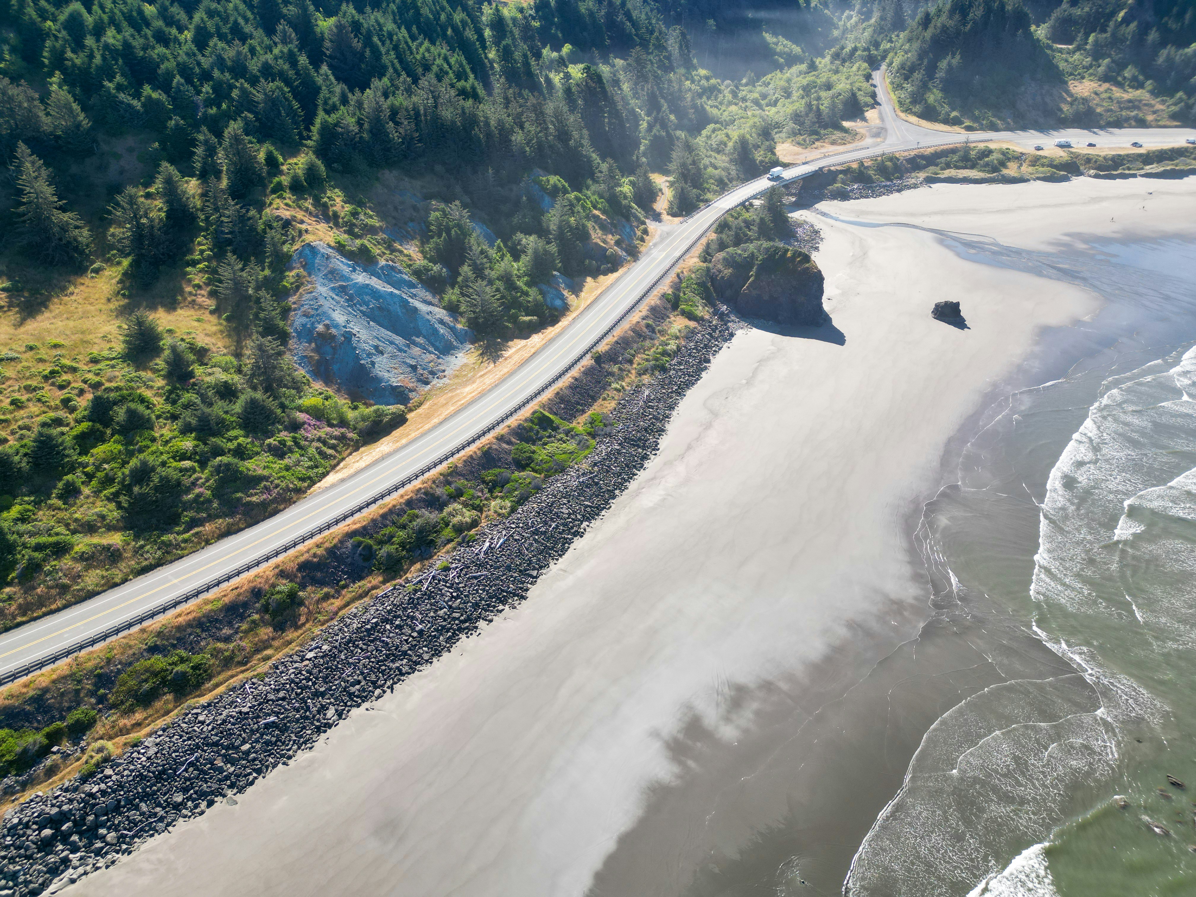 An aerial view of a beach and a highway
