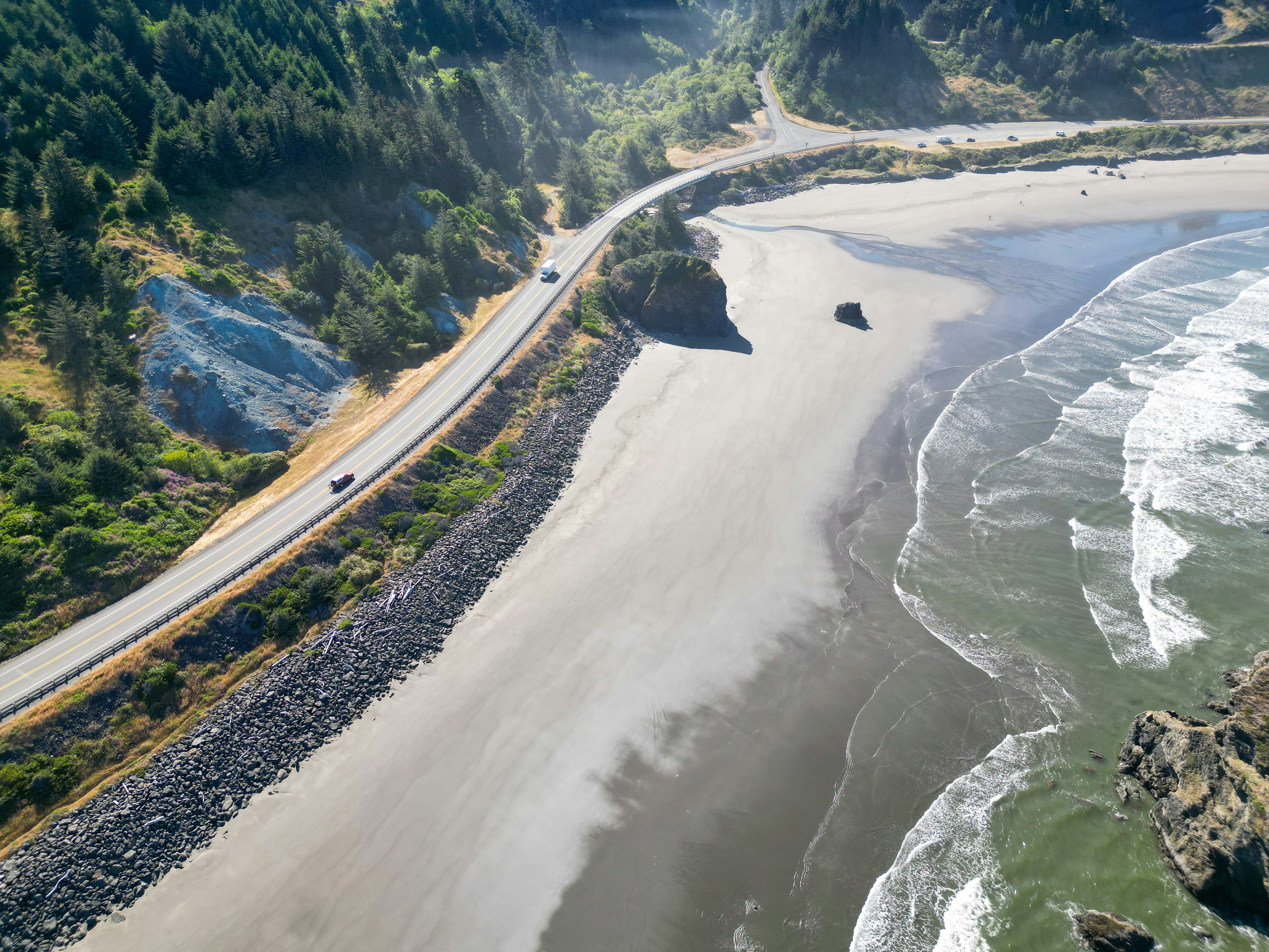 An aerial view of a beach and a highway