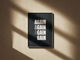 A black and white poster hanging on a wall