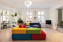 A living room filled with furniture and lots of windows