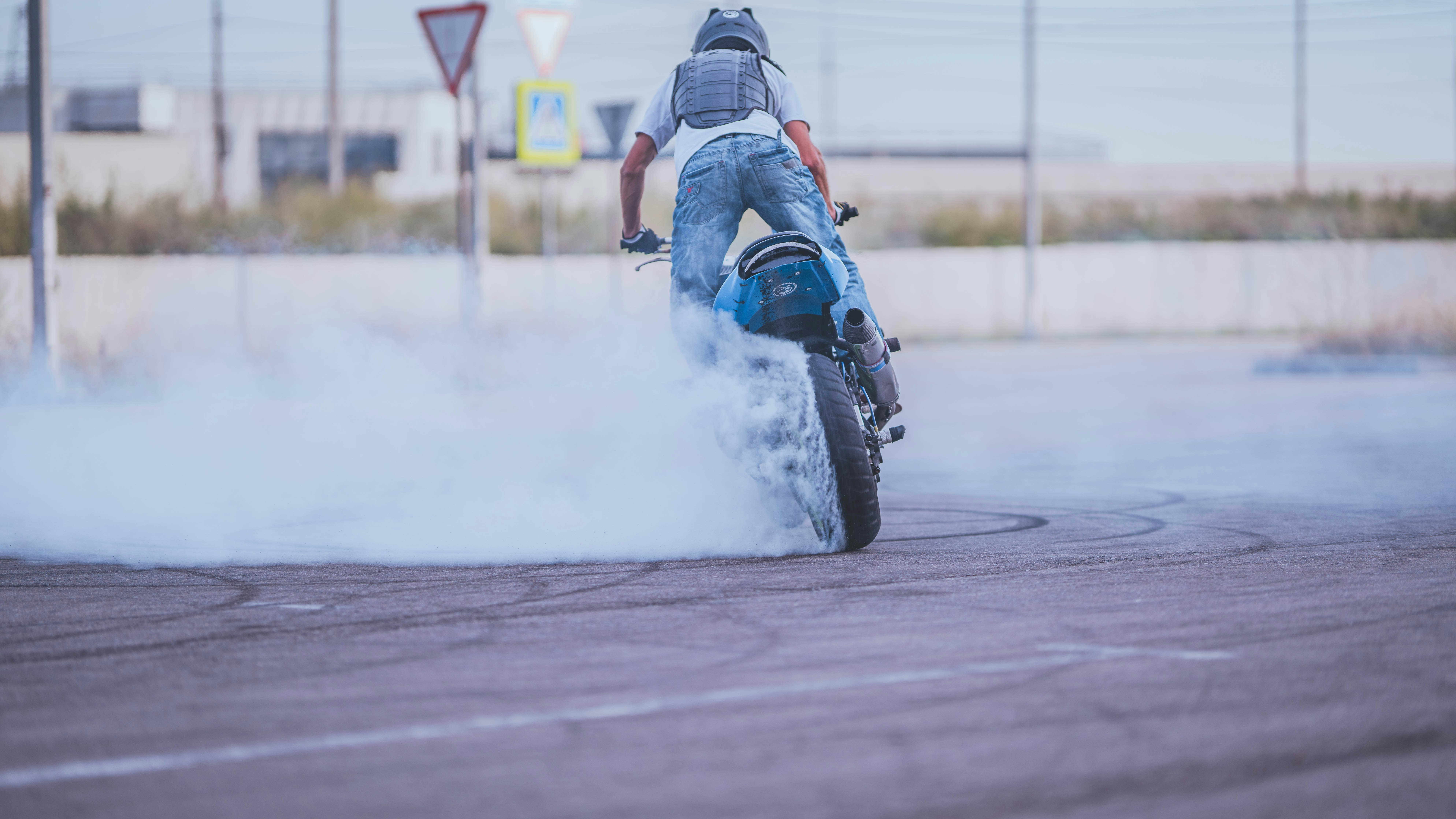 A person riding a motorcycle on a street