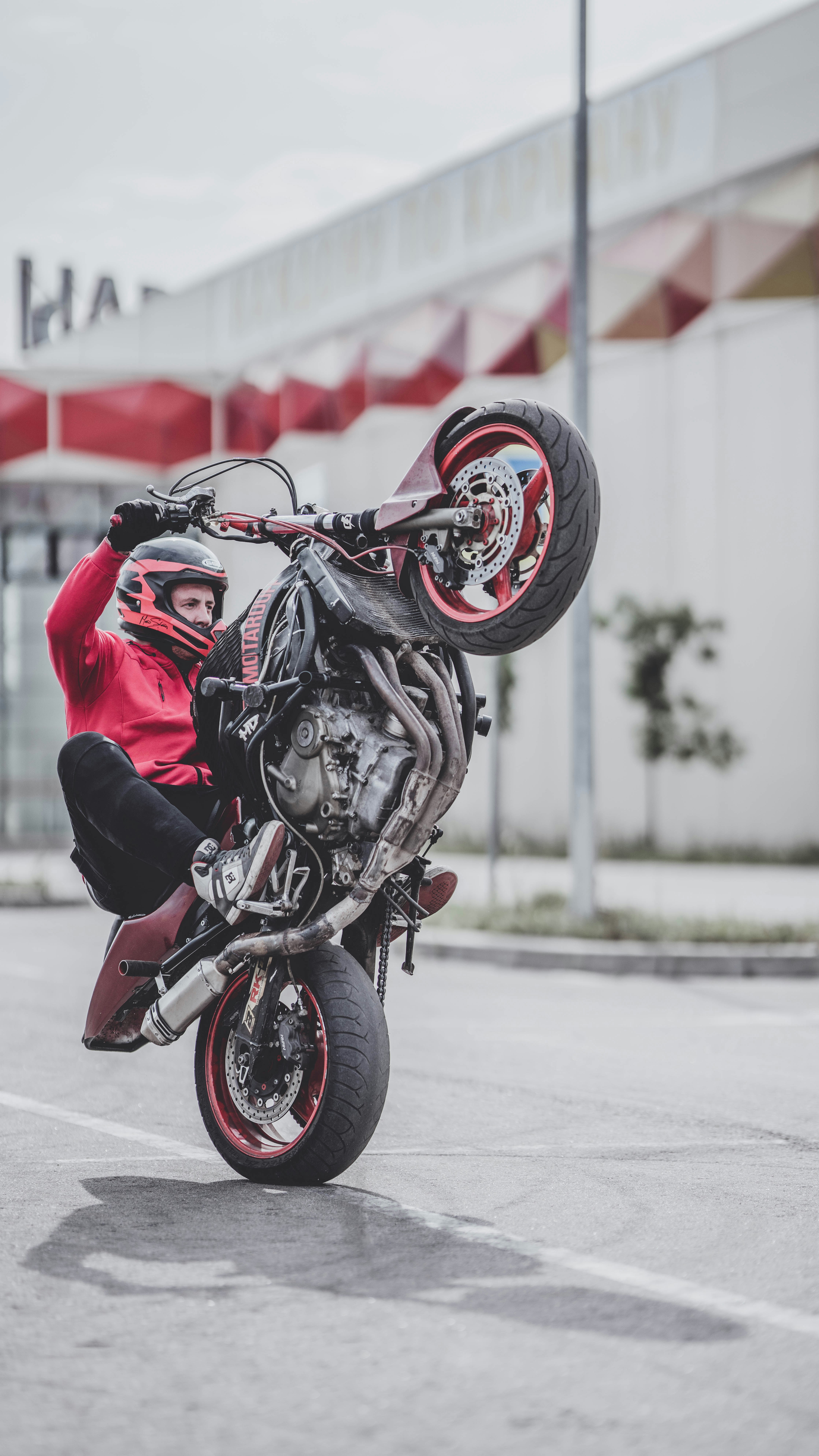 A man doing a wheelie on a motorcycle