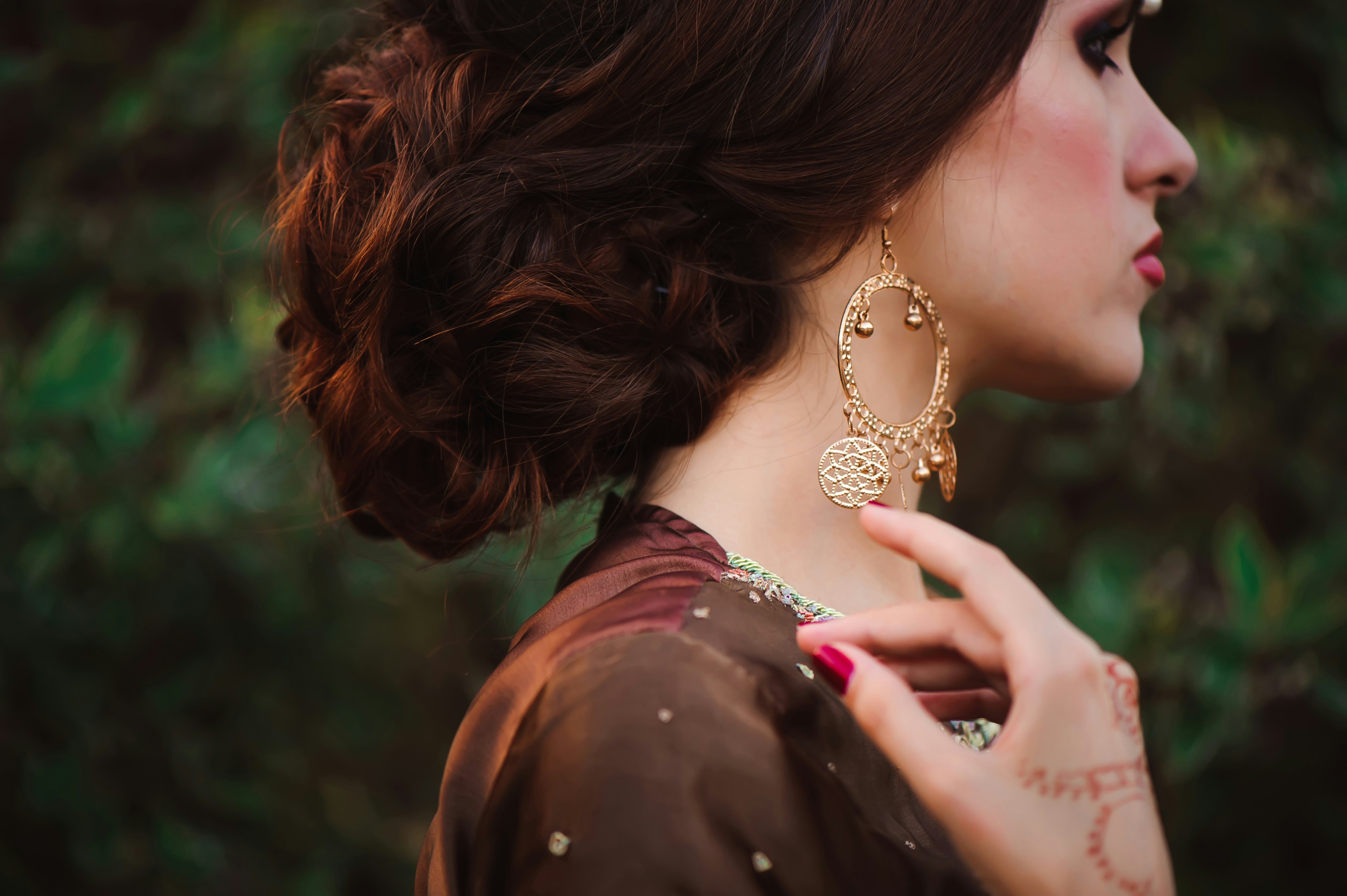 Elegant woman with gold earrings