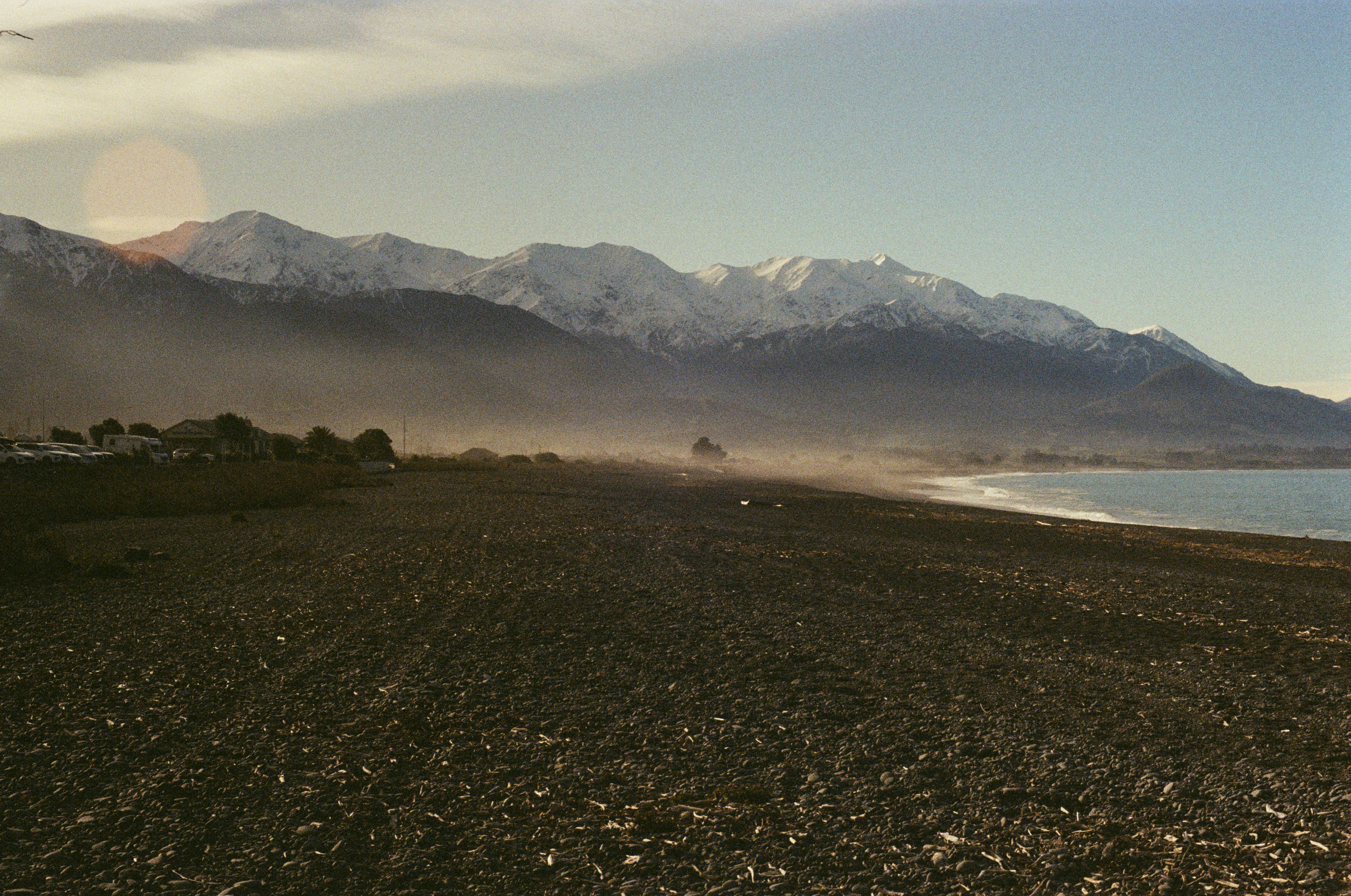 A large body of water surrounded by mountains