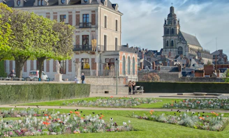 A large building with a garden in front of it