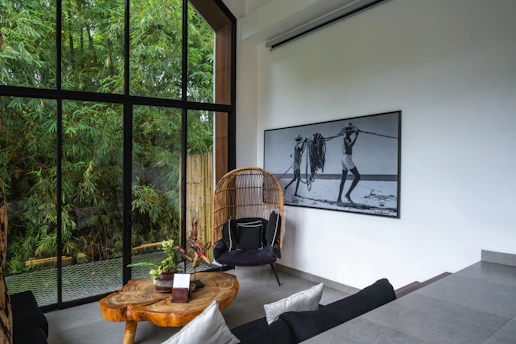 A room with a large window and a wooden table