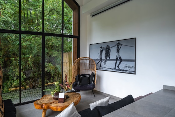 A room with a large window and a wooden table