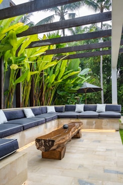 A couch sitting on top of a stone patio