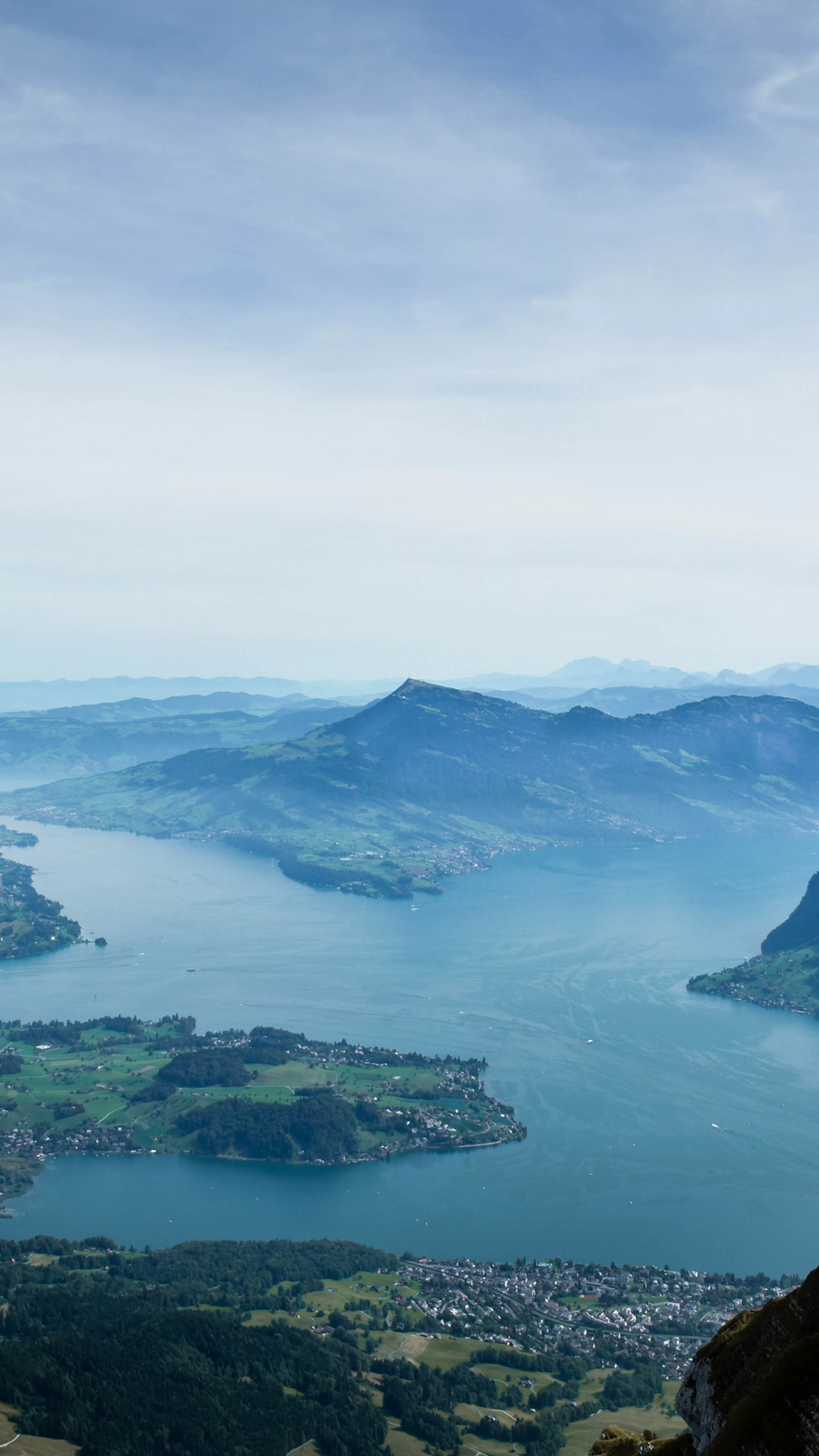 Lake Lucerne below the mountains, the water pale blue between forested ridges