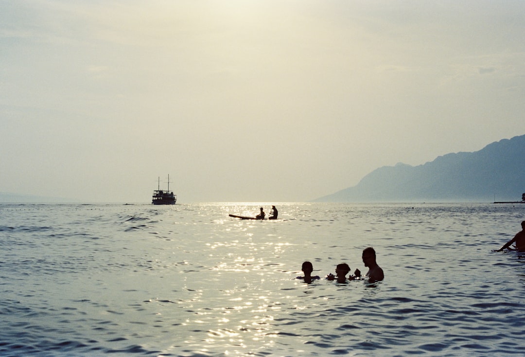 A group of people swimming in the ocean, Photo from Tungsten film roll taken with my AGFA Selectronic 3 in my trip to Cr