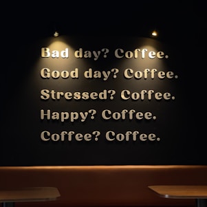 A coffee shop with a lit up sign on the wall