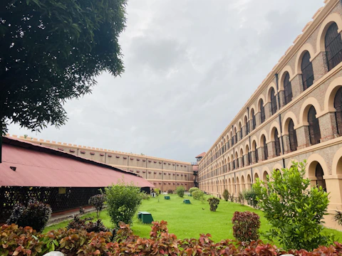 A large building with a green lawn in front of it