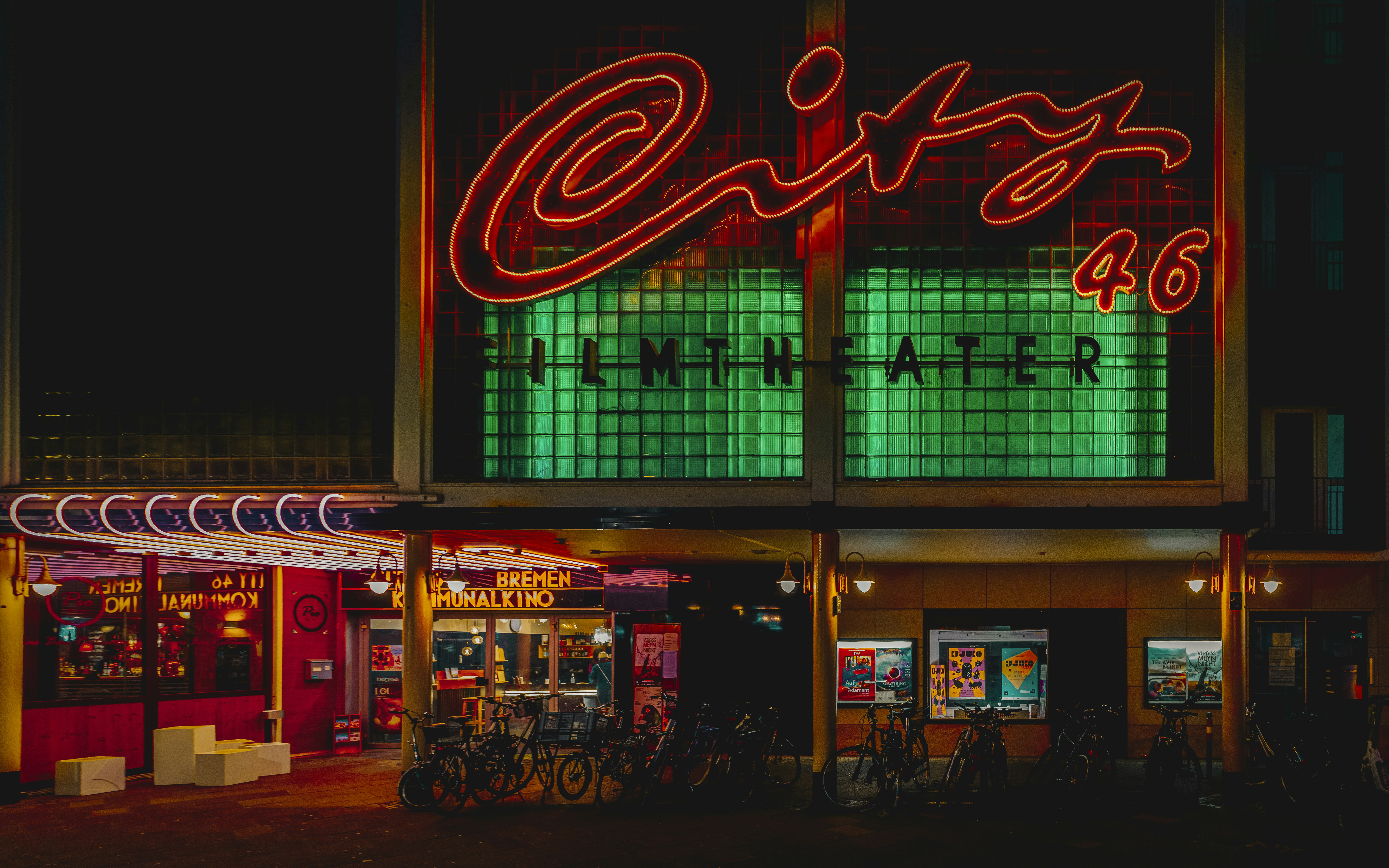 A building that has a neon sign on it