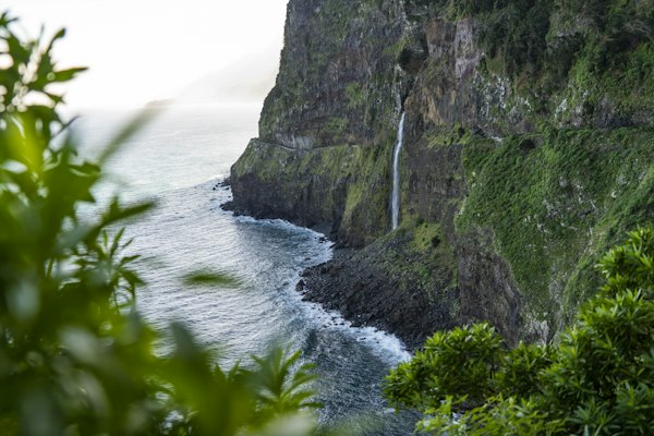 A view of a waterfall in the middle of the ocean — Madeira, Portugal