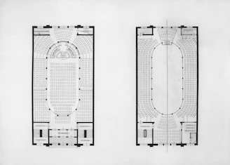 Two architectural floor plans of an oval-shaped building