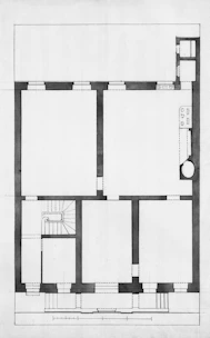 Architectural floor plan of a building with rooms and stairs