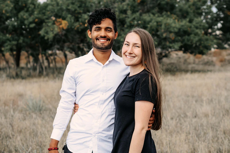 couple standing together in a field