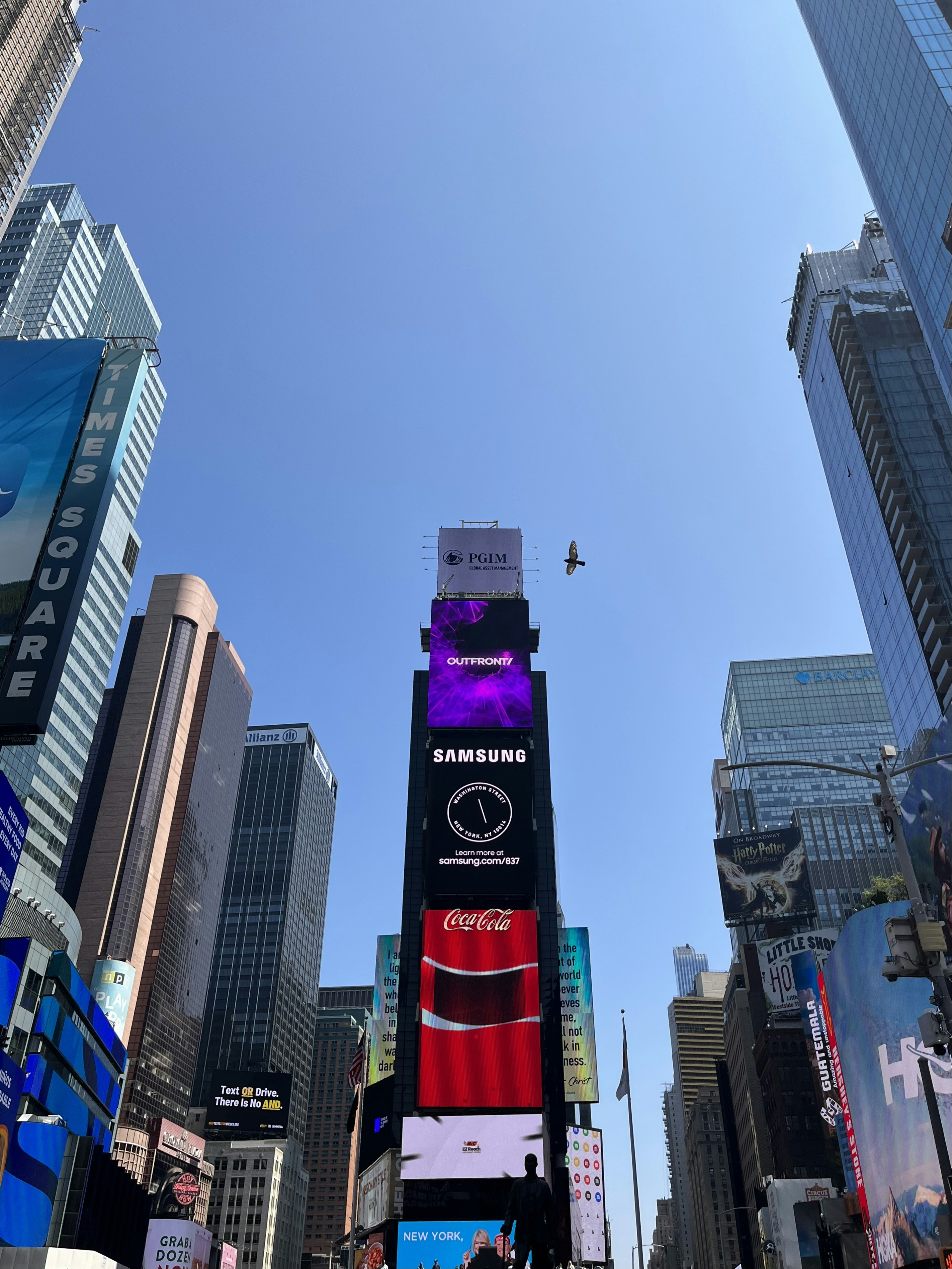 A city street filled with lots of tall buildings